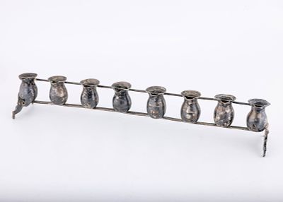 A SILVER HANUKKAH LAMP INSERT. Vienna, c. 1880. Of traditional form for oil. Consisting of 