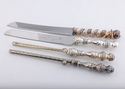 THREE STERLING HANDLED CANDLE HOLDERS AND A CHALLAH KNIFE. Three candle holders with sterling 