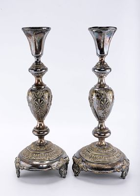 A PAIR OF SILVER PLATED CANDLESTICKS BY NORBLIN. Warsaw, c. 1900. Baroque in design. On three 