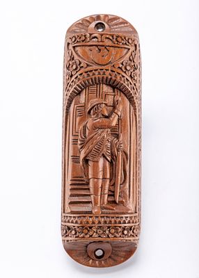 AN ORNATE WOODEN MEZUZAH OF A BOY HANGING A MEZUZAH. Ornately hand carved with a decorative 