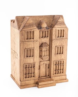A LARGE WOODEN CHARITY BOX IN THE SHAPE OF 770. Israel, modern. Hand crafted from wood. Depicts 