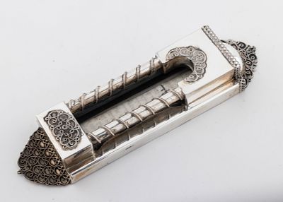 A STERLING SILVER MEZUZAH BY NADAV. Israel, c. 1990. Arch shape. Decorated with filigree 