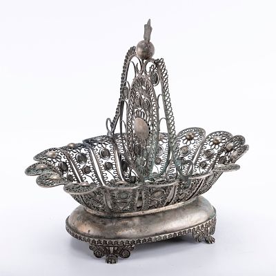 AN EARLY OTTOMAN FILIGREE BASKET. The base is in oval form. The upper portion is filigree. 