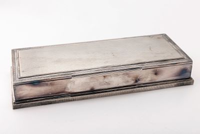 A SILVER CIGARETTE DESK BOX. Probably Dutch,. c. 1920. Art deco in style. 833 silver. With 