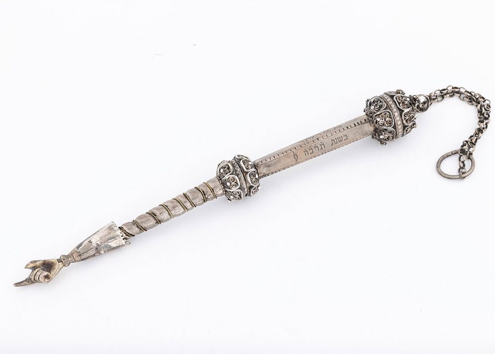 AN IMPORTANT SILVER TORAH POINTER. Poland, 1865. The upper sphere consists of finely threaded 