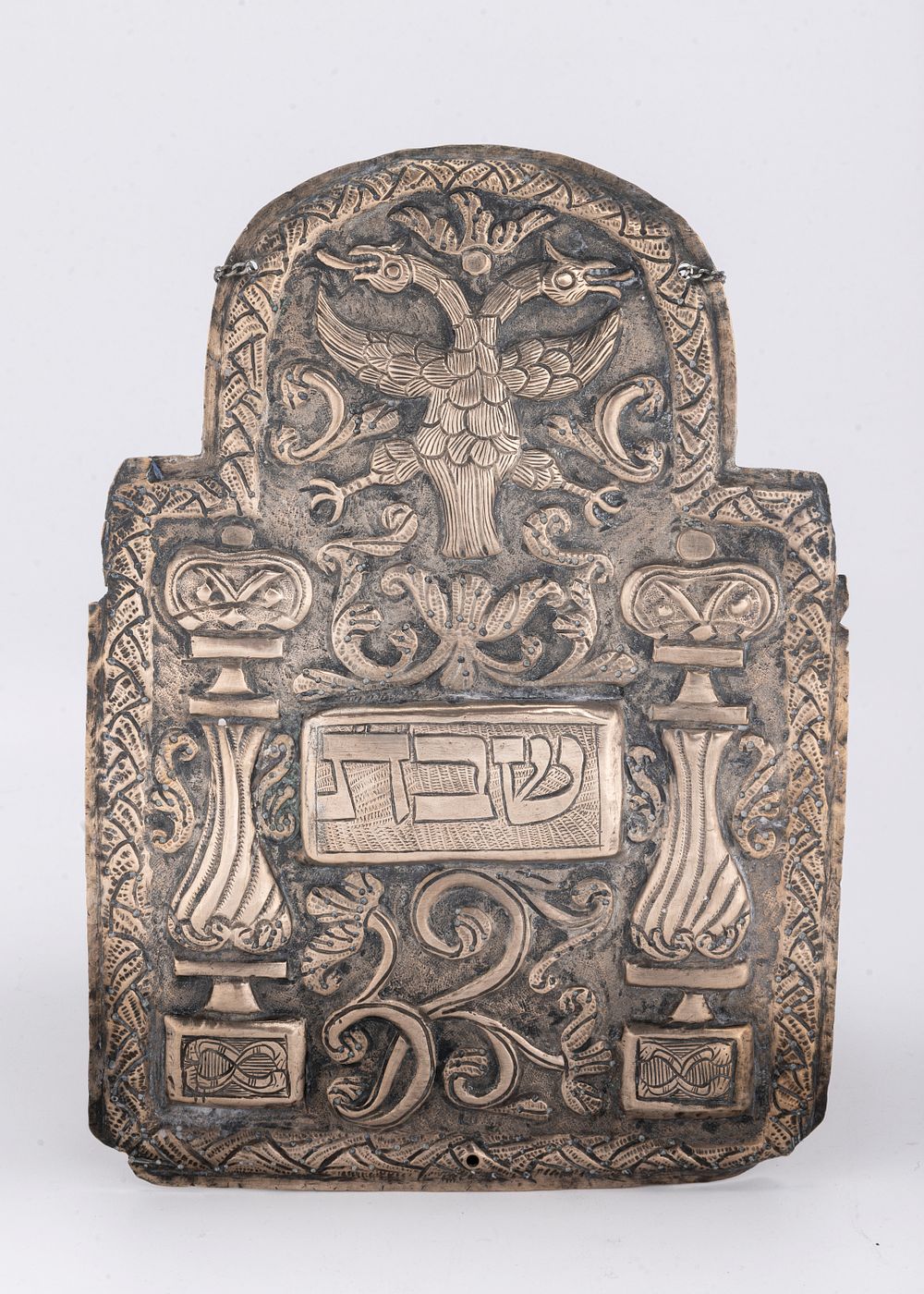 AN EARLY SILVER TORAH SHIELD. Poland, c. 1750. Embossed with a double headed eagel, scrolling 