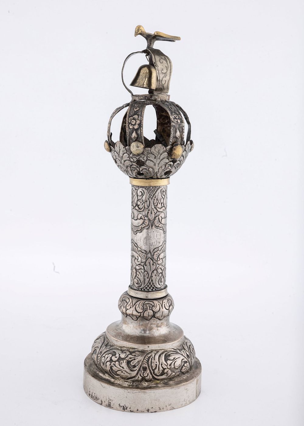 A SILVER TORAH FINIAL. Poland, c. 1800. On a round built up base, chased with flowers and 