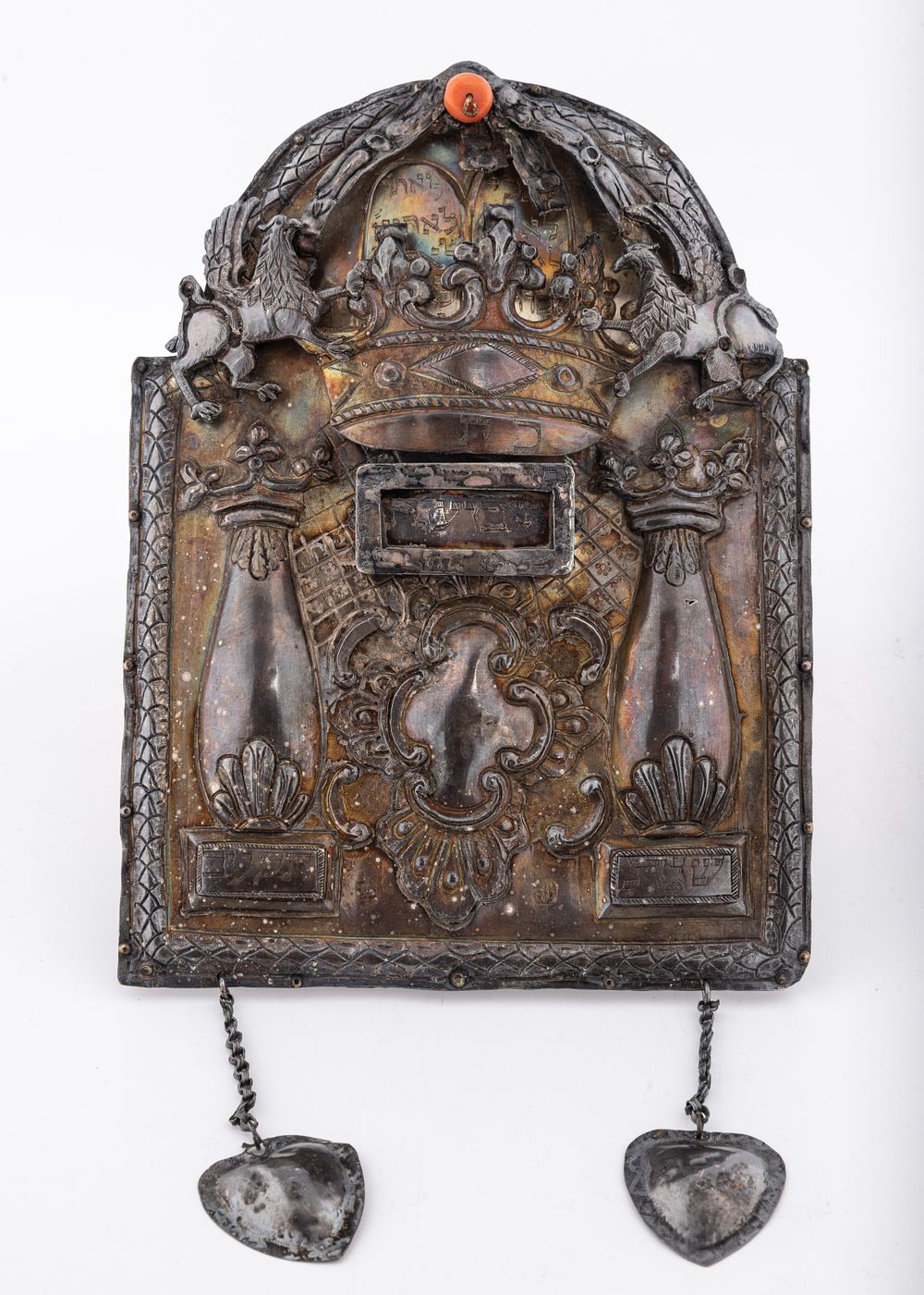AN EARLY SILVER TORAH SHIELD. Poland, c. 1812. Tablet form. Decorated with scrolling designs, a 