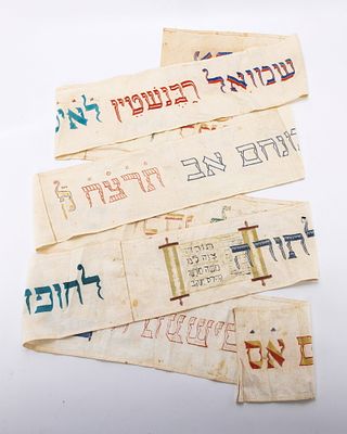 A LINEN TORAH WIMPLE. Germany, 1935. On a white linen base. Embroidered with the name of the 