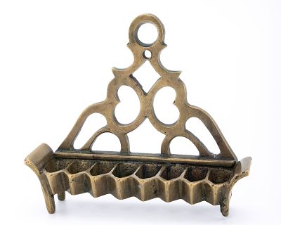 A BRASS HANUKKAH LAMP. Poland, c. 1890. Traditional sofa form. With pierced back plate. Lacking 