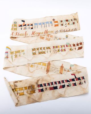 A TORAH WIMPLE. Germany, 1916. On a white linen base. Colorfully painted with the name of the 