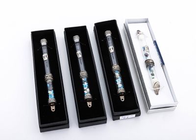 A GROUP OF FOUR STERLING SILVER AND GLASS MEZUZOT. Israel, modern. FOUR STERLING SILVER AND 