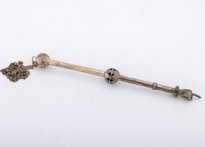 A SILVER TORAH POINTER. Continental, early 20th century. Crafted with two spherical supports 