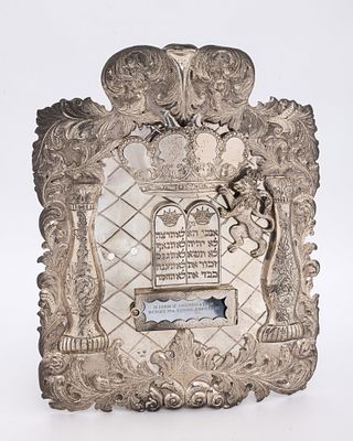 A LARGE SILVER TORAH SHIELD. Berlin, c. 1880. Hand embossed along the sides with scrlling 