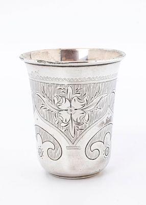 A LARGE SILVER KIDDUSH CUP. Moscow, 1869. Beaker form. Engraved with bright cut designs 