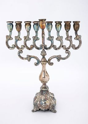 A LARGE STERLING SILVER HANUKKAH MENORAH. Israel, c. 2000. On outwardly tapering base in baroque 