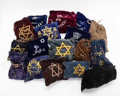 18 PAIRS OF USED TEFILLIN. Various sizes and origins. Some in better condition than others