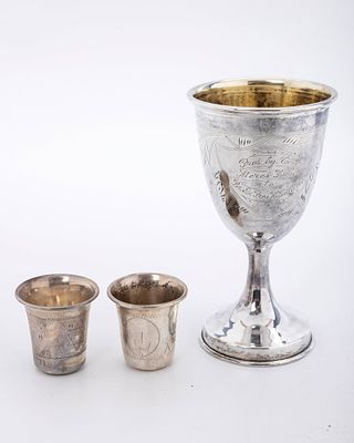 THREE STERLING SILVER KIDDUSH CUPS. American, c. 1900. The first is a large goblet and engraved 