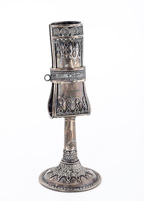 A STERLING SILVER HAVDALLAH CANDLE HOLDER BY THE BEZALEL SCHOOL. On a round wirework based with 