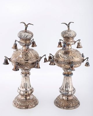 A PAIR OF SILVER TORAH FINIALS. Hungarian, mid-20th century. On round bases chased with floral 