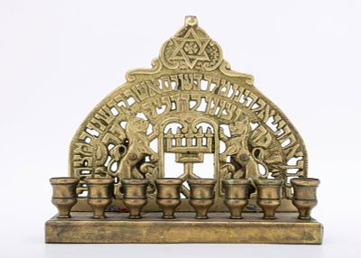 A BRASS HANUKKAH LAMP. Probably USA, early 20th century. Decorated with two lions, the 