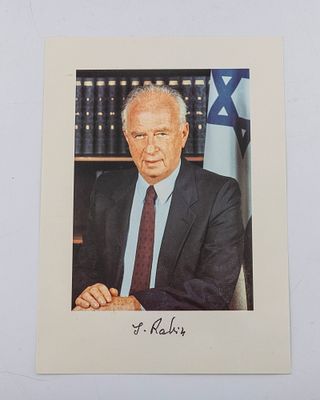 AN AUTOGRAPHED PHOTO OF YITZCHAK RABIN. Israel, c. 1990. In an official pose while standing in 