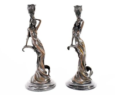 Pair of Art Nouveau Bronze Figural Candlesticks | The sculpted candlesticks have sinuous female 