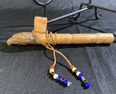 Native American Hand-Carved Pipe - Pipe is sculpted as an eagles head, with engravings of Bison