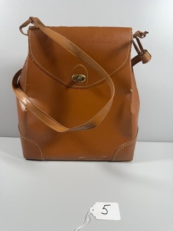 Leather Shoulder Bag. This structured, medium brown shoulder bag or satchel features a front 