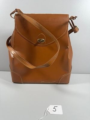 Leather Shoulder Bag. This structured, medium brown shoulder bag or satchel features a front 