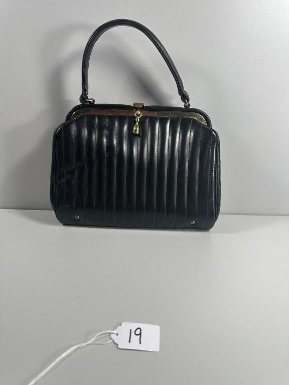 Vertical Quilted Top-Handle Handbag, 7" tall. A vertical quilted top-handle handbag. This 