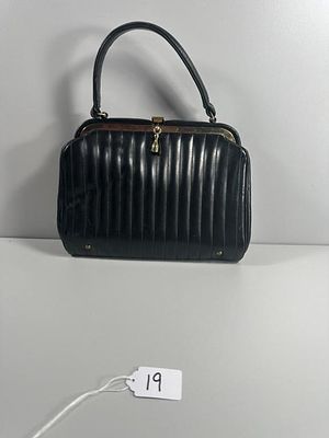 Vertical Quilted Top-Handle Handbag, 7" tall. A vertical quilted top-handle handbag. This 