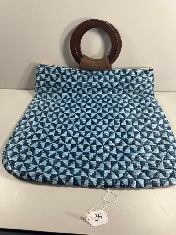 An Echo Woven Trapezoidal Tote Bag. An Echo woven trapezoidal tote bag, constructed from a woven 