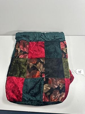 A 16" Tall Patchwork Velvet Backpack, Made in Chin. A soft-sided fabric backpack constructed 