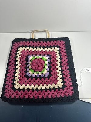 Crochet Granny Square Tote Bag with Floral Appliqu. A square-shaped crocheted tote bag 