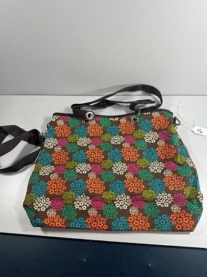 Fabric Tote Bag. A fabric tote bag, featuring a vibrant, multicolored floral pattern of 