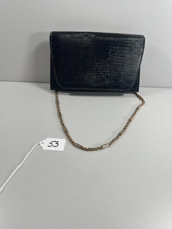 Ande Black Embossed Reptile Texture Clutch with Go. An Ande black clutch-style handbag 