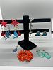 A Collection of Colorful Costume Jewelry. A collection of costume jewelry featuring various Image - 1