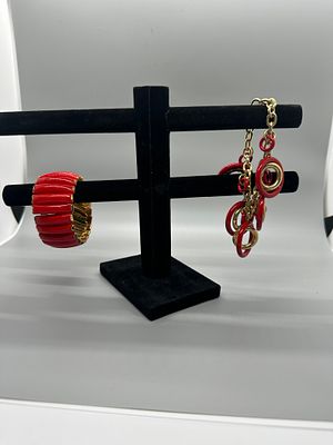 A Collection of Red and Gold Tone Jewelry. A collection of red and gold-tone jewelry featuring a 
