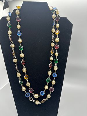 Multi-Colored Glass and Faux Pearl Station Necklace. A silver-tone station necklace featuring 