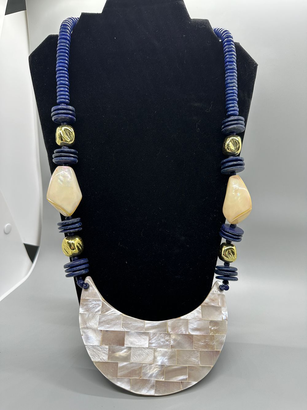 Beaded Statement Necklace with Shell Inlay Crescent Pendant. A statement necklace featuring blue 