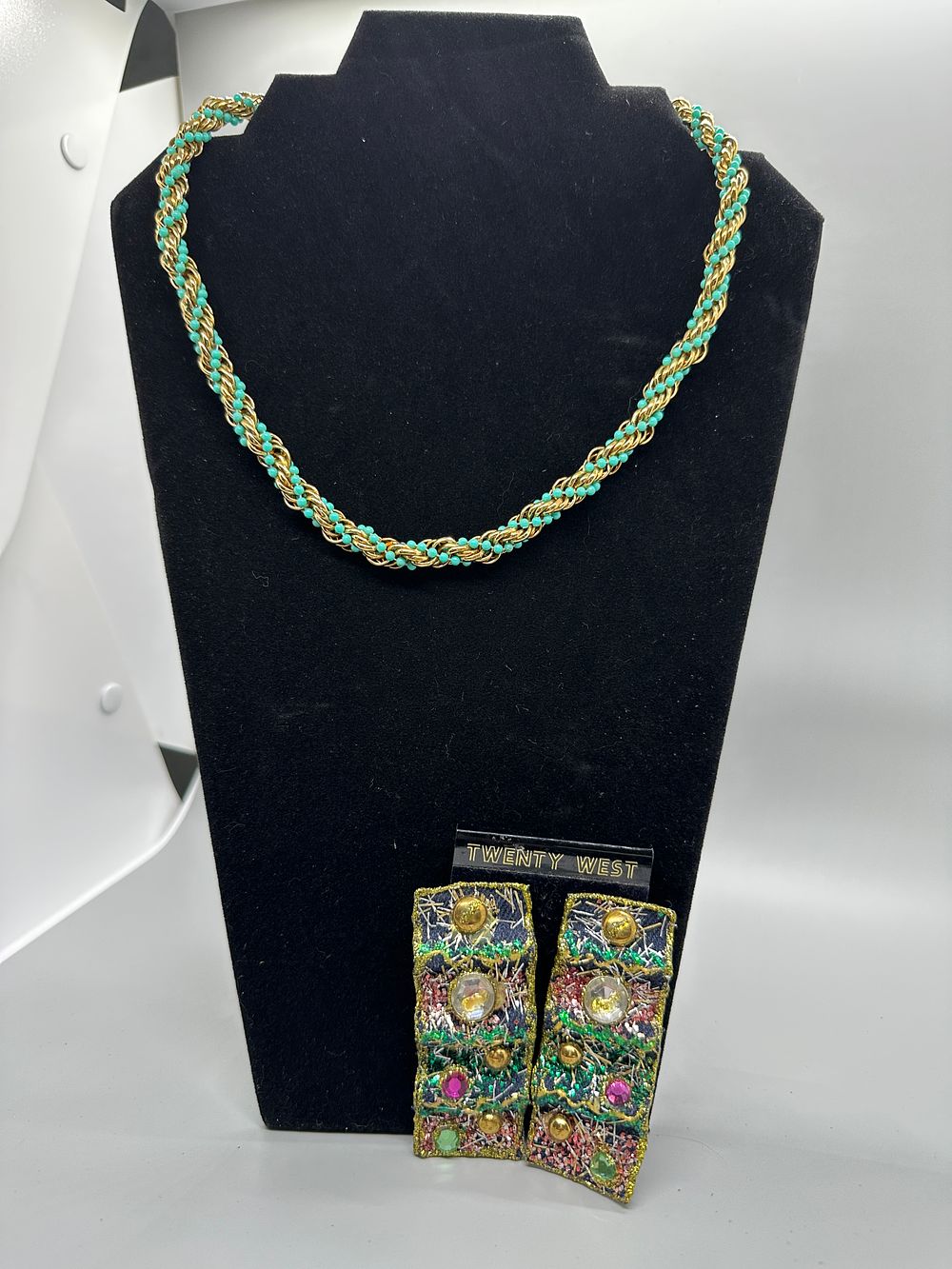 Twenty West Beaded Necklace and Embroidered Earrings. A gold-toned and turquoise beaded necklace 