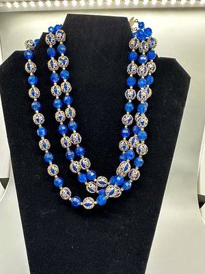 Triple Strand Blue Faceted and Gold Toned Filigree Bead Necklace. A triple-strand necklace 