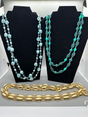 A Collection of Beaded and Link Necklaces. A collection of beaded and link necklaces in various 