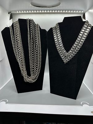 A Collection of Silver Tone Multi Strand Necklaces. A collection of silver-tone multi-strand 