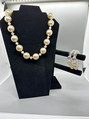 Faux Pearl Necklace and Iridescent Multi-Strand Beaded Bracelet. A cream-colored faux pearl 