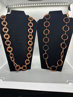 Two Necklaces with Amber Colored and Brown Circular Links. Two necklaces featuring amber-colored 