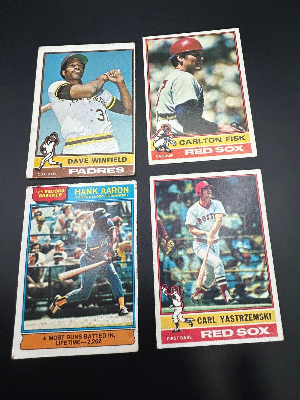 Lot 157: A Collection of 1976 Topps Baseball Cards featuring Hank Aaron, Dave Winfield, Carl Yastrzemski, and Carlton Fisk