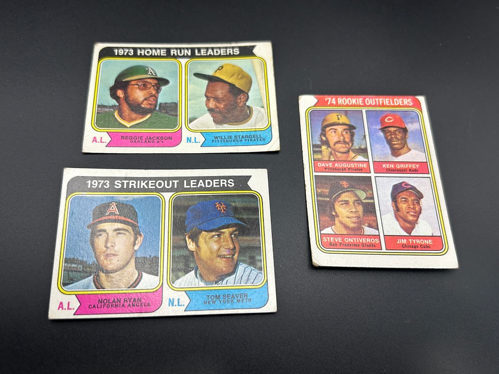 Lot 163: A Trio of 1974 Topps Baseball Cards Featuring Hall of Fame Leaders and Ken Griffey Rookie