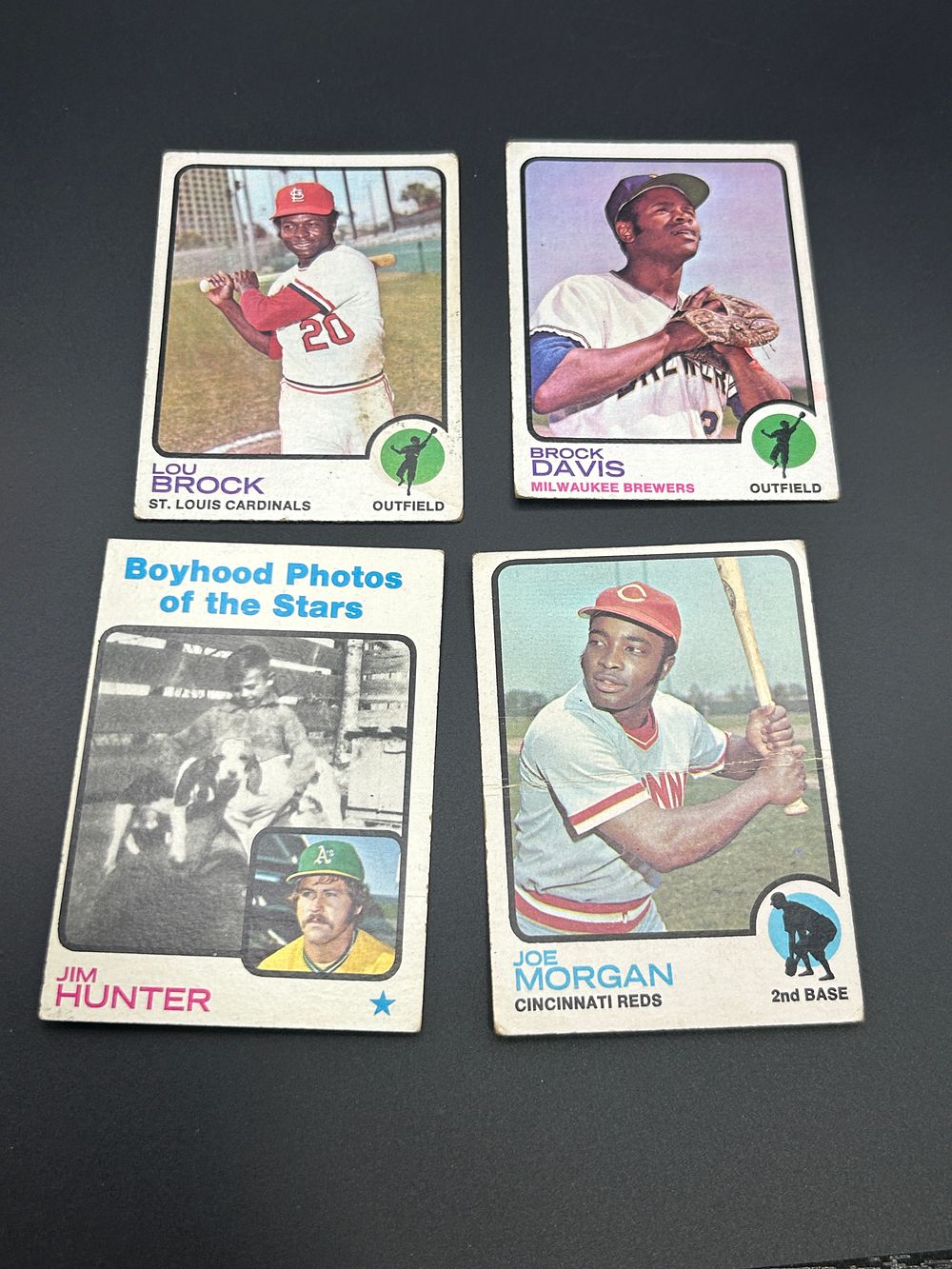 Lot 170: A Collection of four 1973 Topps Baseball Cards Including Joe Morgan Lou Brock and Jim Hunter